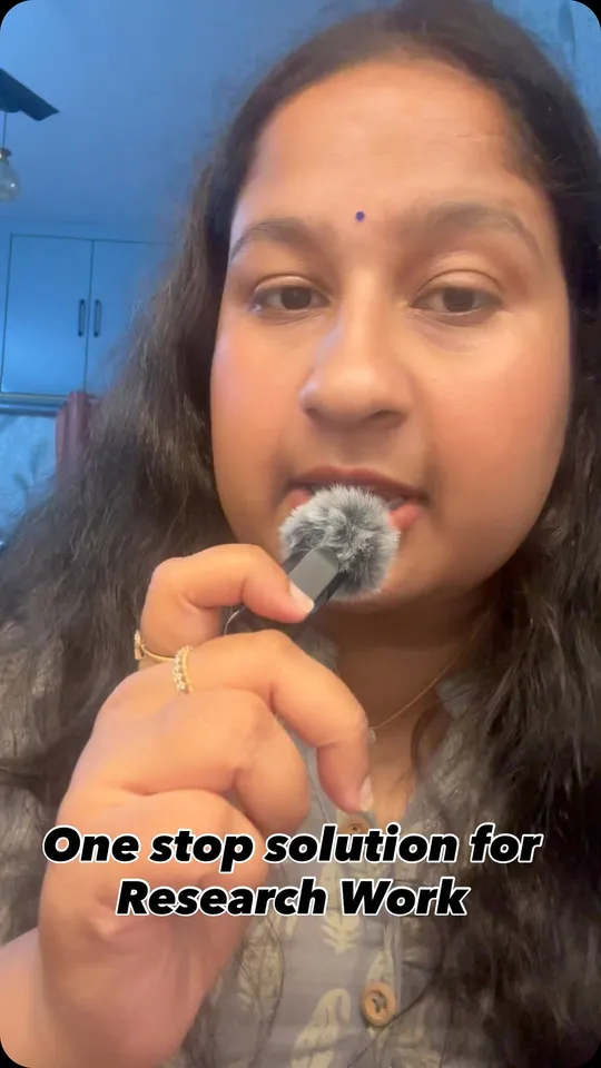 A researcher holding a clip-on microphone to camera, with a caption reading "One stop solution for Research Work"